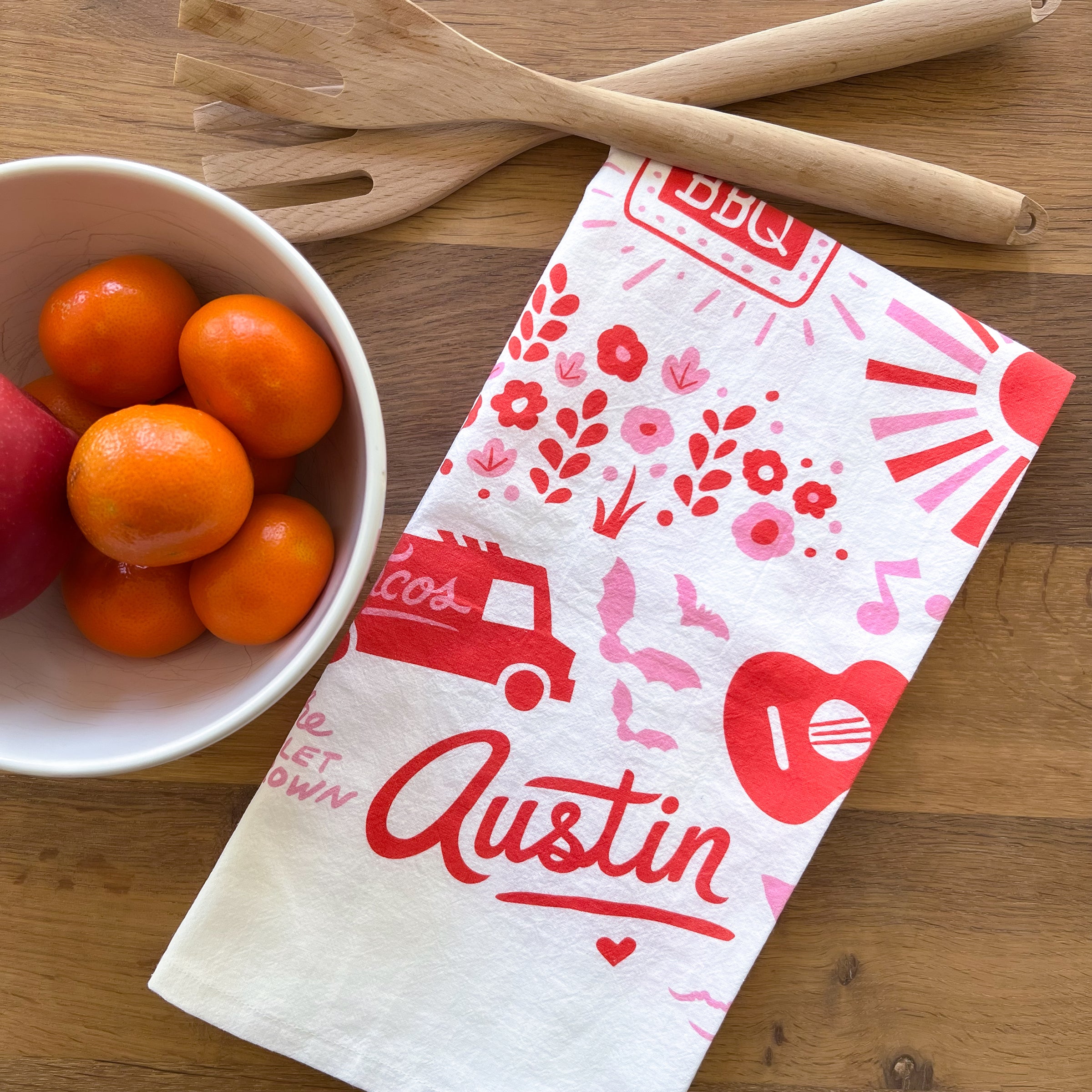This Austin tea towel is covered in bright, bold, Austin icons. It's a white flour sack tea towel with red and pink art, all created by Austin Illustrator, Annie Mayfield. Makes a great, uniquely Austin host gift!