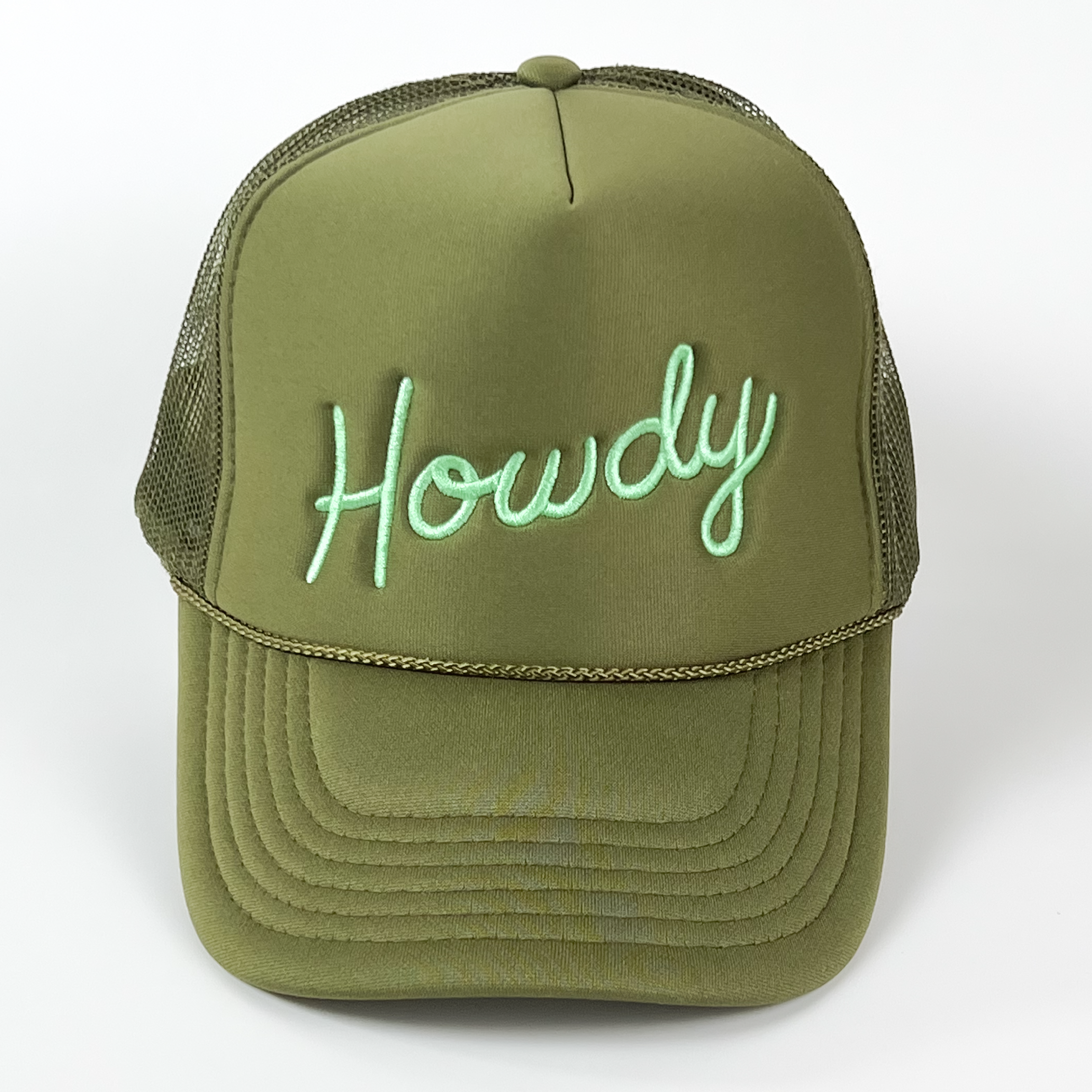 This embroidered 'Howdy' trucker cap is a versatile favorite, with its unique olive green and mint color combination. It was uniquely hand-lettered, and has a touch of western twang!