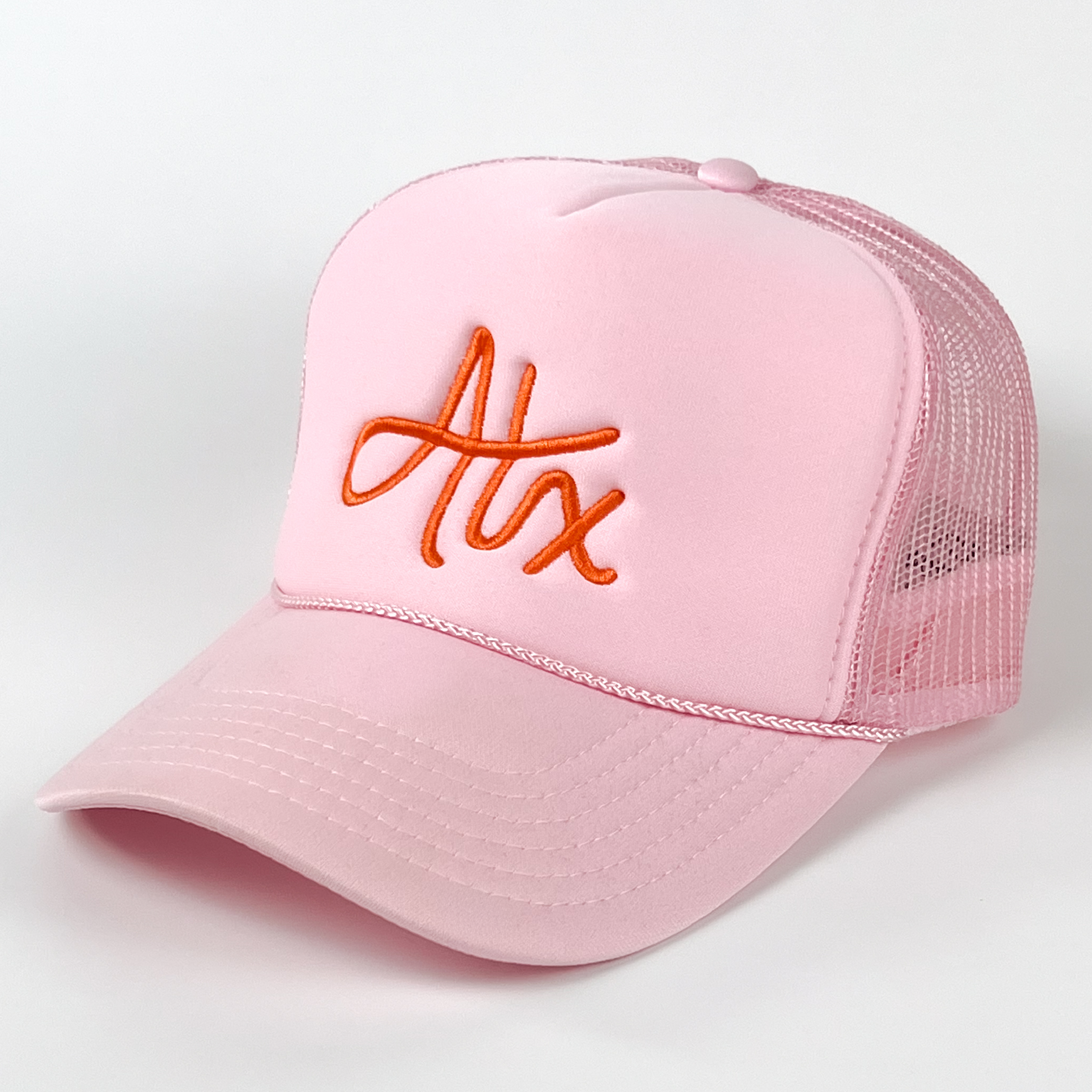 This Austin cap is boldly fun, with orange embroidery on a light pink cap. It has hand-drawn lettering and is quickly becoming one of our bestsellers!