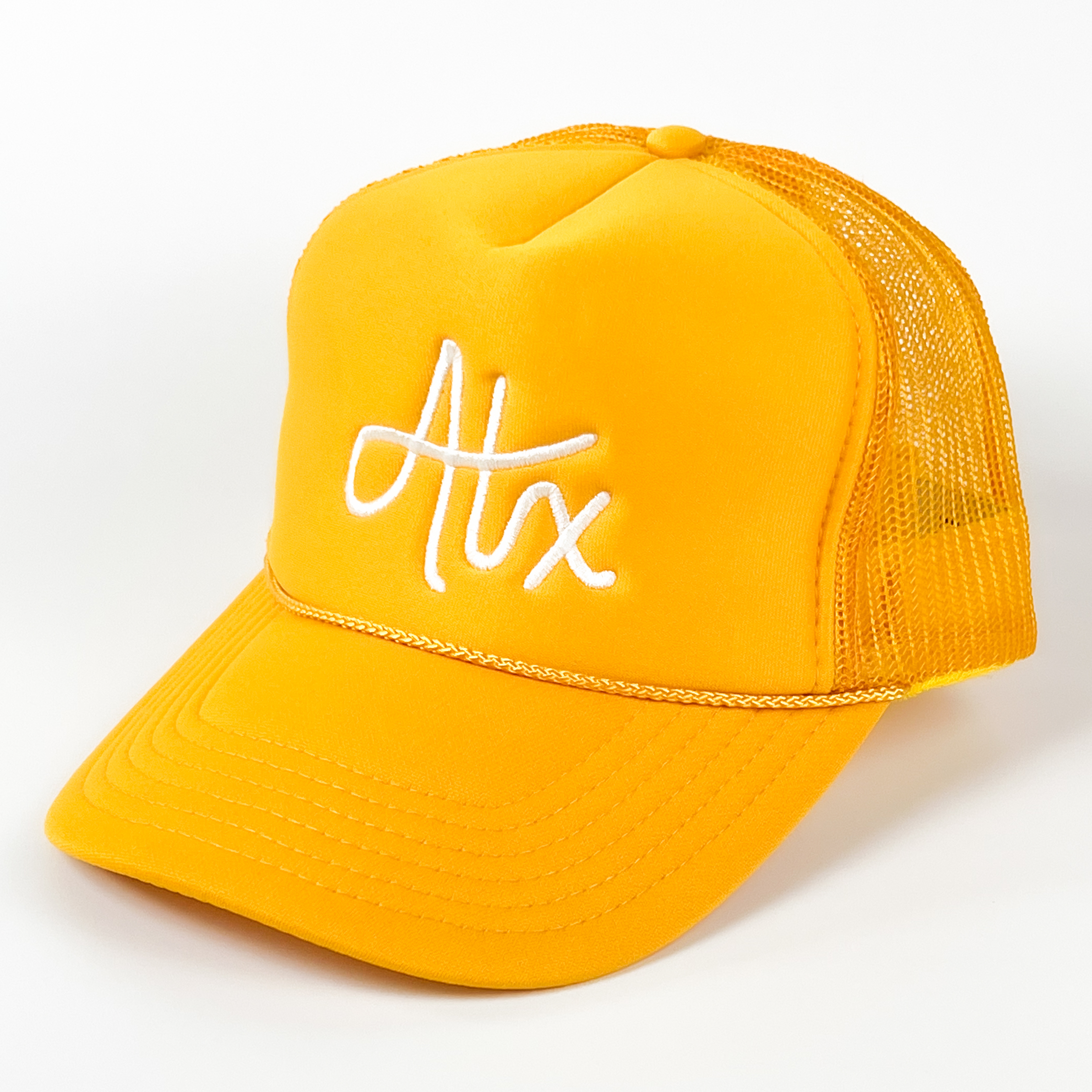 Bright and sunny, this yellow Austin trucker cap begs you to get out and have some fun in ATX sun! Perfect for a day at the lake, your favorite swimming hole, or a stroll down SOCO!