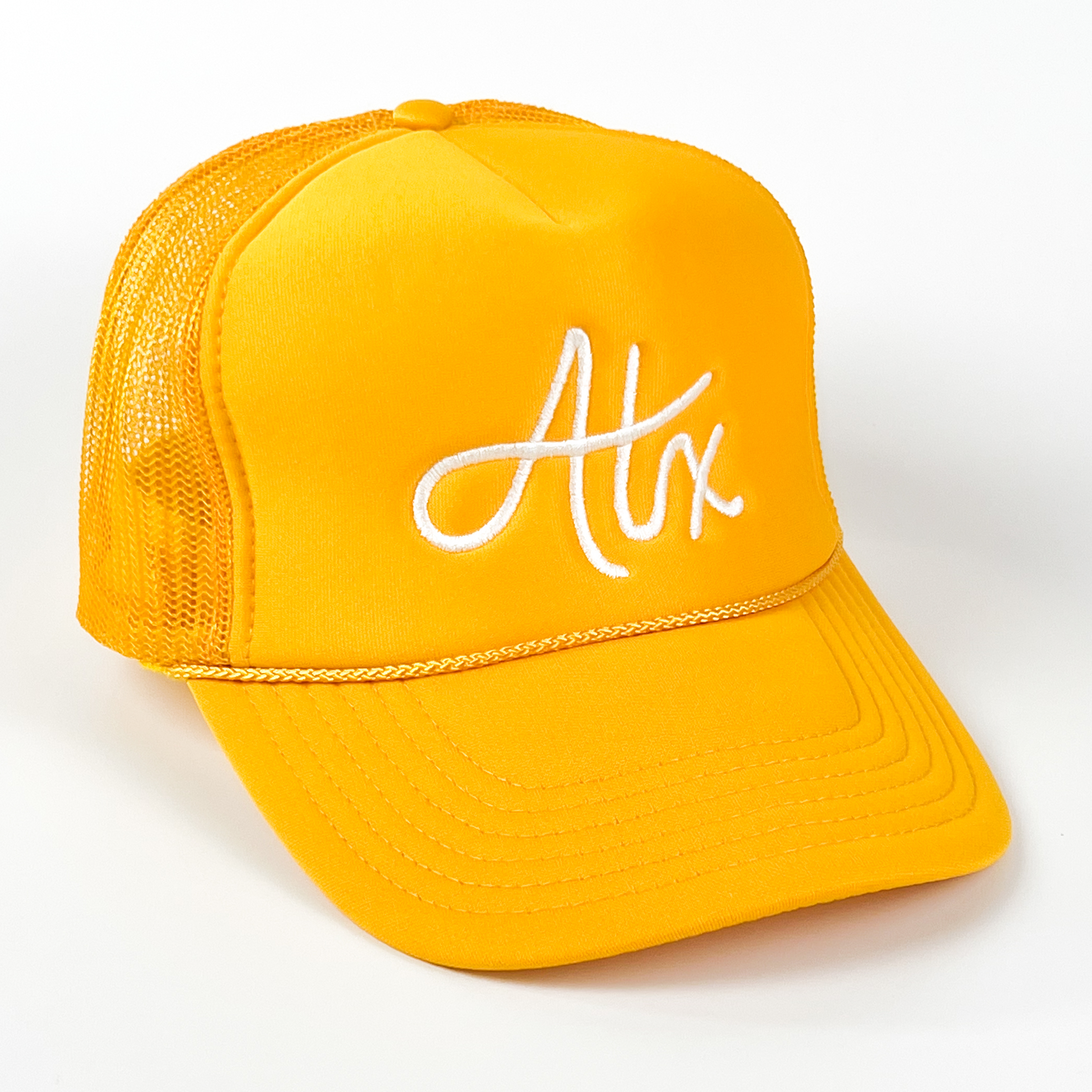 Bright and sunny, this yellow Austin trucker cap begs you to get out and have some fun in ATX sun! Perfect for a day at the lake, your favorite swimming hole, or a stroll down SOCO!